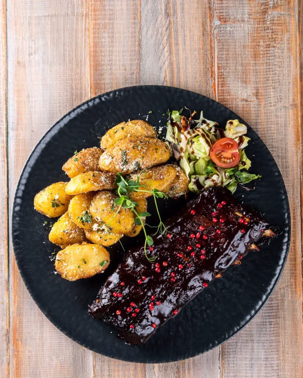 Coaste de porc la cuptor în sos Barbeque